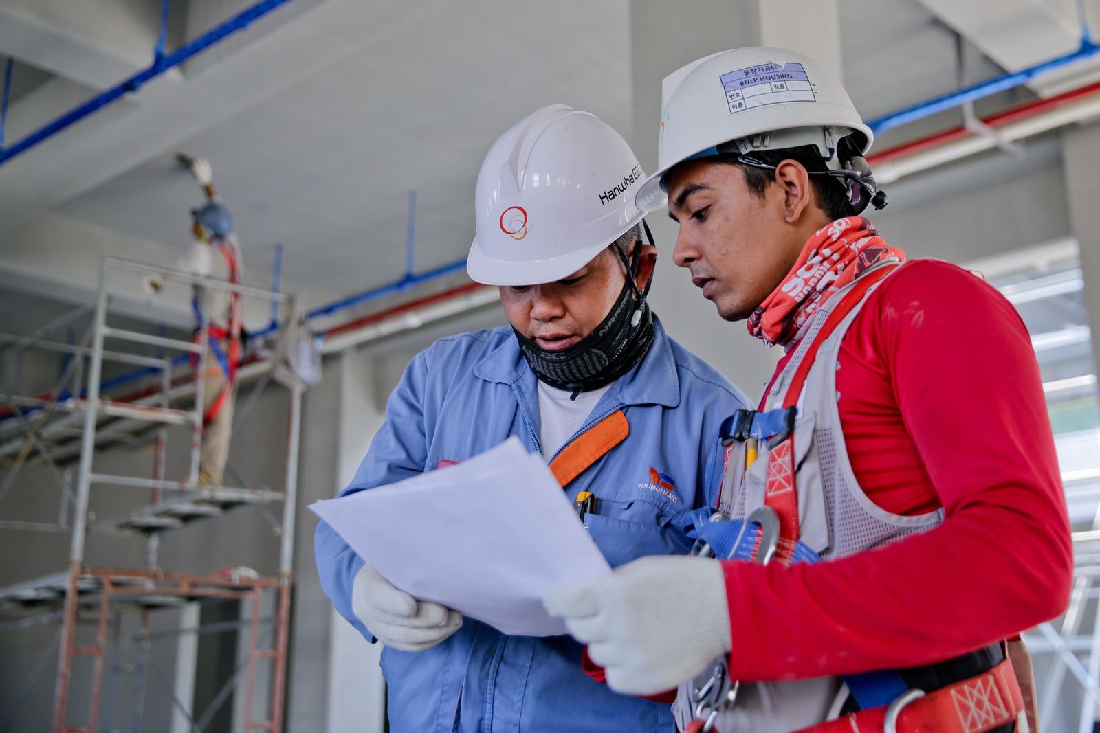 Electricians working together on a job site