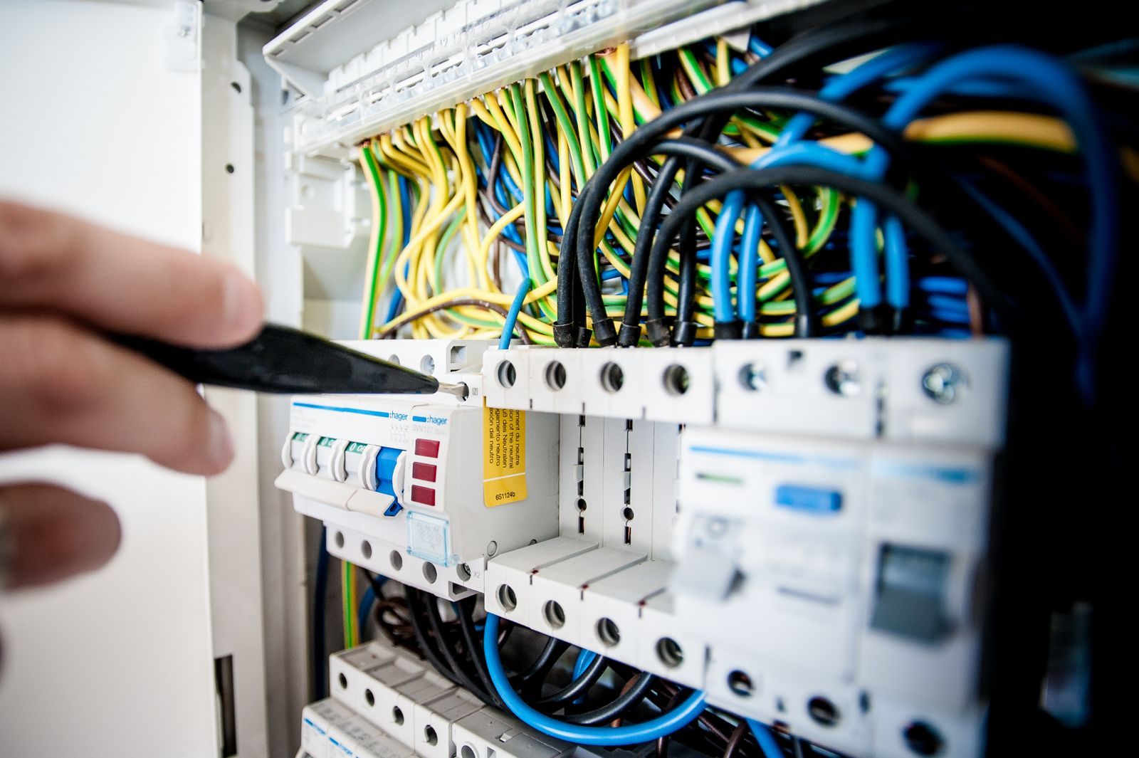 Electrician testing an electrical panel